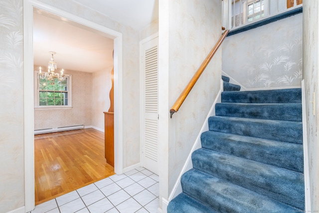 10 Laurel Glen Dr, East Hampton, CT 06424 - staircase with a baseboard radiator, a chandelier, wallpapered walls, wood finished floors, and baseboards