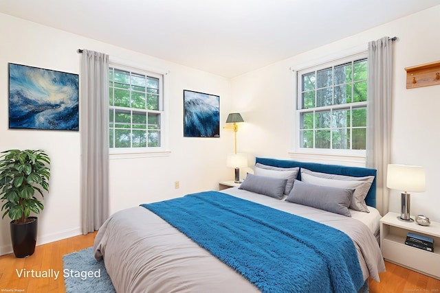 10 Laurel Glen Dr, East Hampton, CT 06424 - bedroom featuring multiple windows and wood finished floors