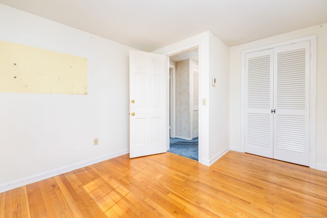 10 Laurel Glen Dr, East Hampton, CT 06424 - unfurnished bedroom with baseboards, light wood finished floors, and a closet