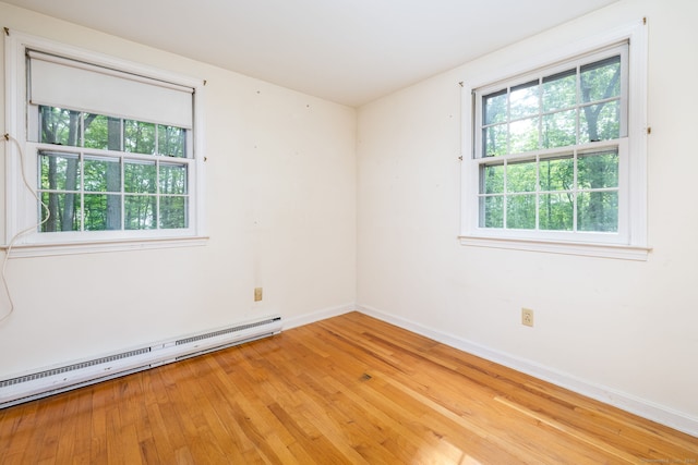 10 Laurel Glen Dr, East Hampton, CT 06424 - empty room with a baseboard radiator, baseboards, and light wood finished floors