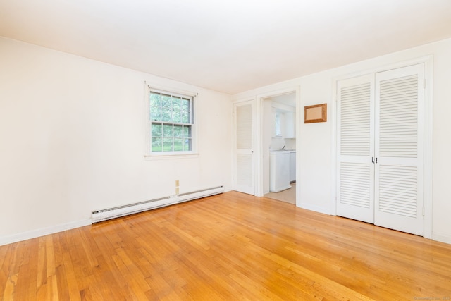 10 Laurel Glen Dr, East Hampton, CT 06424 - unfurnished bedroom featuring baseboard heating, light wood-type flooring, washer / clothes dryer, a closet, and ensuite bath