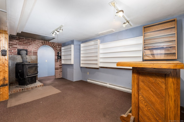 10 Laurel Glen Dr, East Hampton, CT 06424 - bar area with a baseboard heating unit, brick wall, carpet floors, and a wood stove