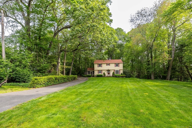 10 Laurel Glen Dr, East Hampton, CT 06424 - view of front of home with a front yard and a view of trees