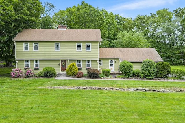 103 Pine St, Columbia, CT 06237 - colonial inspired home with a chimney, a front lawn, and roof with shingles