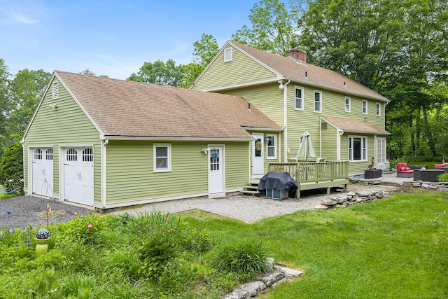 103 Pine St, Columbia, CT 06237 - back of house featuring a wooden deck, a lawn, a detached garage, and a shingled roof