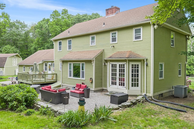 103 Pine St, Columbia, CT 06237 - back of house with an outdoor hangout area, central AC unit, a deck, a patio, and a chimney