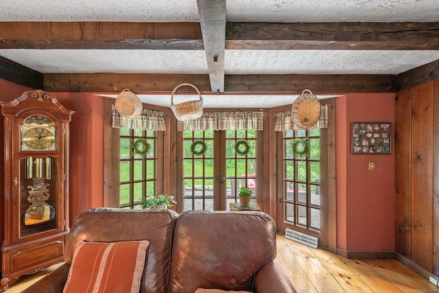 103 Pine St, Columbia, CT 06237 - dining room featuring healthy amount of natural light, french doors, light wood-type flooring, beam ceiling, and baseboards