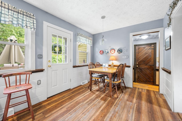 103 Pine St, Columbia, CT 06237 - dining space with wood finished floors and a textured ceiling