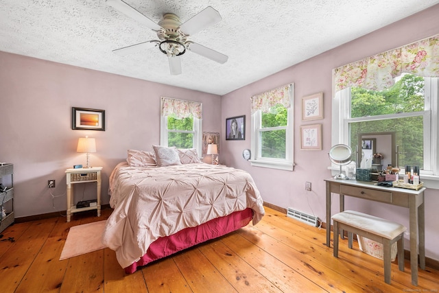 103 Pine St, Columbia, CT 06237 - bedroom featuring hardwood / wood-style floors, a textured ceiling, baseboards, and ceiling fan