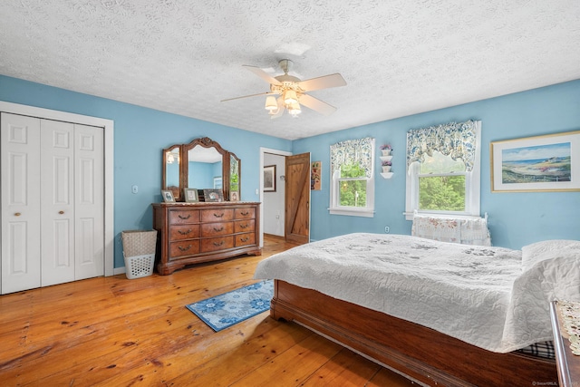 103 Pine St, Columbia, CT 06237 - bedroom with a textured ceiling, hardwood / wood-style flooring, ceiling fan, and a closet