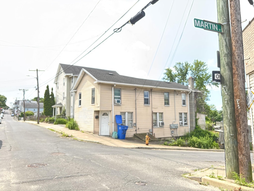 32 Ridge St, Waterbury, CT 06706 - view of asphalt road featuring sidewalks, curbs, and street lighting