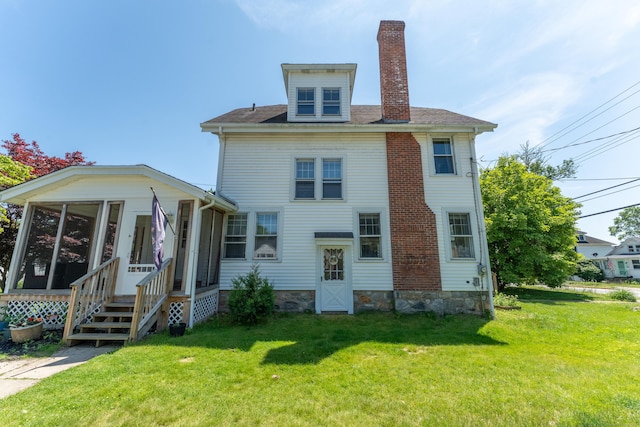 90 Broad St, Killingly, CT 06239 - back of property with a sunroom, a chimney, and a yard