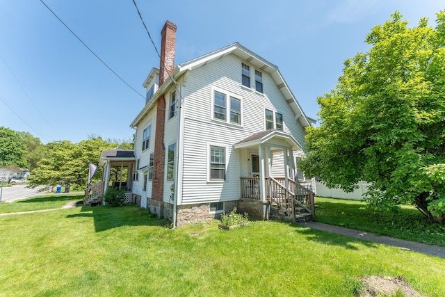90 Broad St, Killingly, CT 06239 - view of front of house with a chimney and a front yard