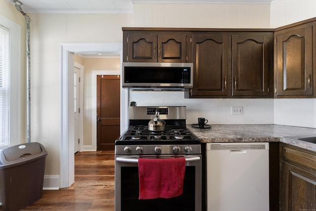 90 Broad St, Killingly, CT 06239 - kitchen with appliances with stainless steel finishes, ornamental molding, dark wood finished floors, and dark brown cabinetry