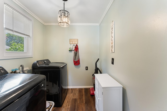 90 Broad St, Killingly, CT 06239 - washroom featuring washing machine and clothes dryer, crown molding, dark wood-style flooring, and a chandelier