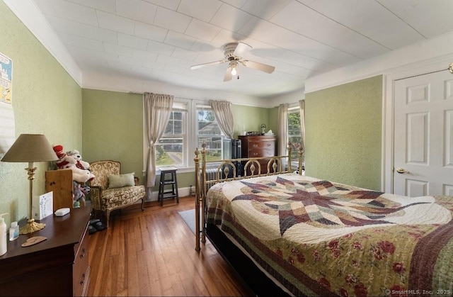 90 Broad St, Killingly, CT 06239 - bedroom featuring a textured wall, hardwood / wood-style floors, and ceiling fan