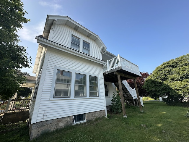 90 Broad St, Killingly, CT 06239 - back of house featuring a wooden deck, stairway, and a lawn