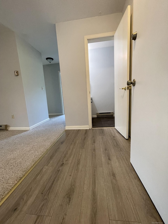 782 Oronoke Rd Apt 33, Waterbury, CT 06708 - unfurnished room featuring wood finished floors, baseboard heating, and baseboards