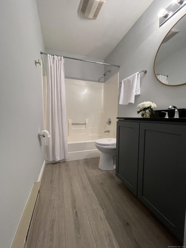 782 Oronoke Rd Apt 33, Waterbury, CT 06708 - bathroom featuring shower / bath combination with curtain, toilet, wood finished floors, and vanity