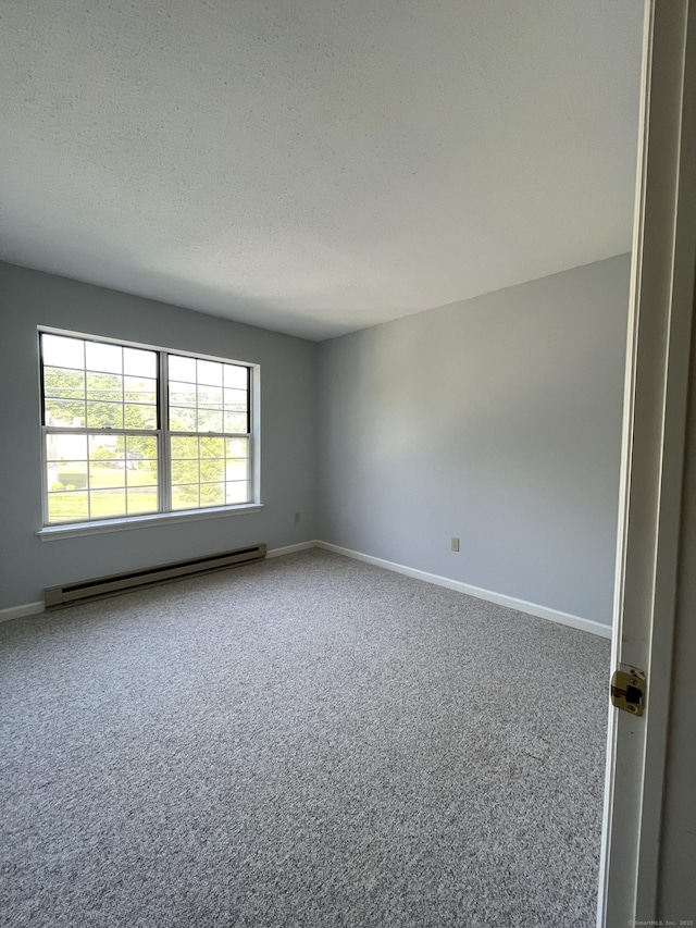 782 Oronoke Rd Apt 33, Waterbury, CT 06708 - carpeted spare room featuring baseboard heating, a textured ceiling, and baseboards