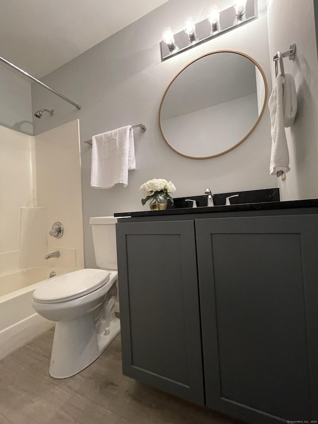 782 Oronoke Rd Apt 33, Waterbury, CT 06708 - full bath featuring bathtub / shower combination, toilet, vanity, and wood finished floors