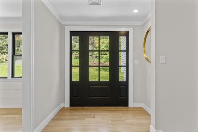 193 Stoner Dr, West Hartford, CT 06107 - entrance foyer featuring plenty of natural light, light wood-style flooring, and crown molding