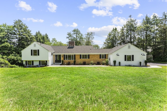 193 Stoner Dr, West Hartford, CT 06107 - view of front facade with a chimney, a front yard, and a shingled roof