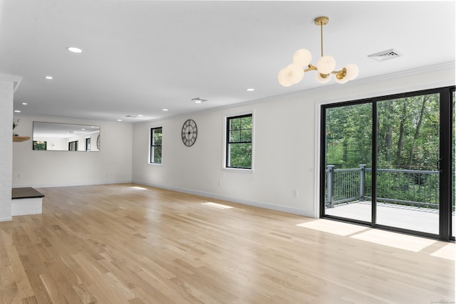 193 Stoner Dr, West Hartford, CT 06107 - unfurnished living room with ornamental molding, light wood-type flooring, recessed lighting, and a chandelier