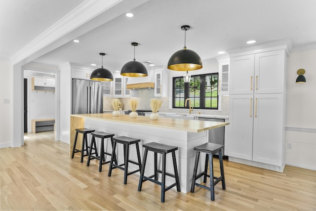 193 Stoner Dr, West Hartford, CT 06107 - kitchen with stainless steel appliances, light countertops, light wood-style floors, white cabinets, and recessed lighting
