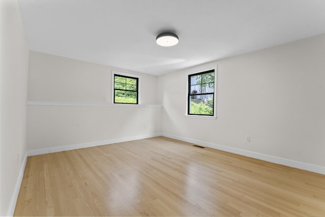 193 Stoner Dr, West Hartford, CT 06107 - empty room featuring healthy amount of natural light and wood finished floors