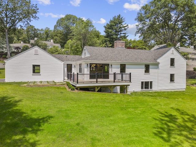 193 Stoner Dr, West Hartford, CT 06107 - rear view of property featuring a wooden deck, a lawn, a chimney, and roof with shingles