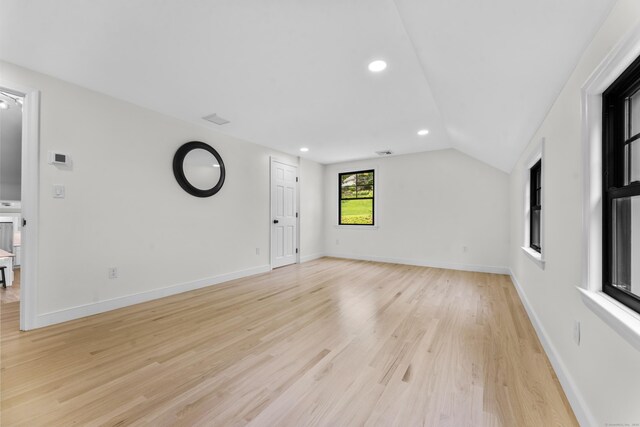 193 Stoner Dr, West Hartford, CT 06107 - unfurnished living room with light wood-type flooring, vaulted ceiling, and recessed lighting