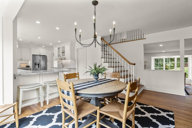22 Douglas Dr, Norwalk, CT 06850 - dining room featuring light wood-type flooring, stairway, recessed lighting, baseboards, and a chandelier