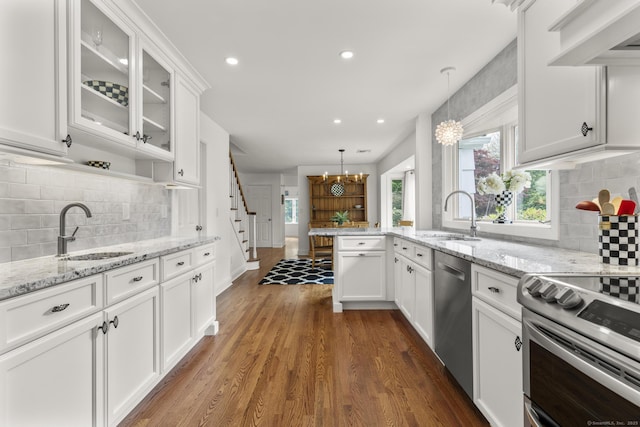 22 Douglas Dr, Norwalk, CT 06850 - kitchen with a sink, appliances with stainless steel finishes, tasteful backsplash, and recessed lighting