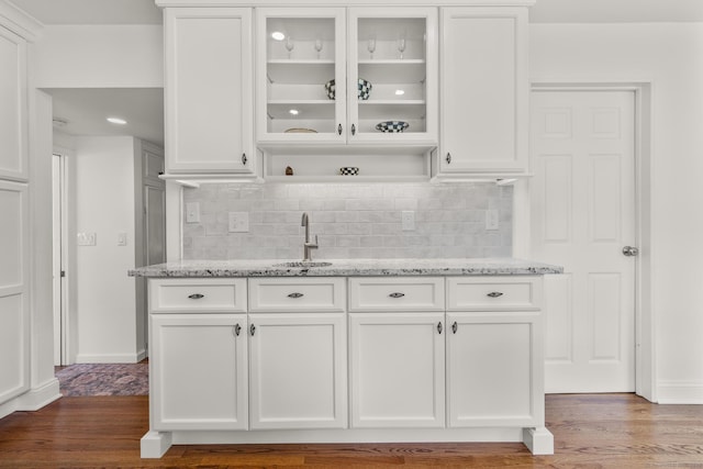 22 Douglas Dr, Norwalk, CT 06850 - indoor wet bar with backsplash, wood finished floors, and baseboards