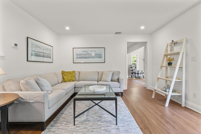 22 Douglas Dr, Norwalk, CT 06850 - living room with wood finished floors, baseboards, and recessed lighting