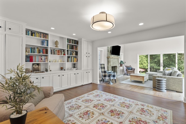 22 Douglas Dr, Norwalk, CT 06850 - living area featuring a stone fireplace, dark wood-style flooring, and recessed lighting