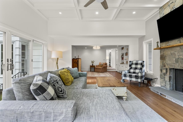 22 Douglas Dr, Norwalk, CT 06850 - living room with wood finished floors, a stone fireplace, ceiling fan, recessed lighting, and beamed ceiling