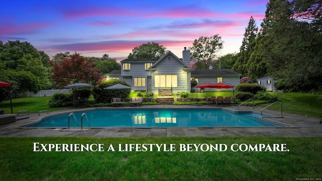 22 Douglas Dr, Norwalk, CT 06850 - pool at dusk with a yard and an outdoor pool
