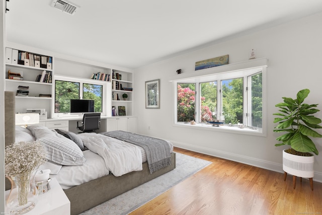22 Douglas Dr, Norwalk, CT 06850 - bedroom featuring an office area, wood finished floors, and baseboards