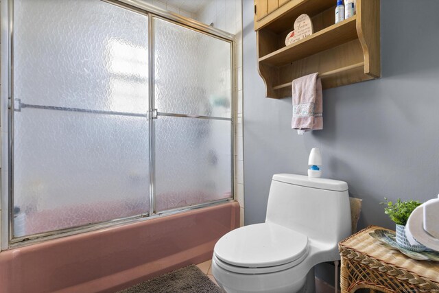 112 Vermont Ave, Stratford, CT 06615 - bathroom with combined bath / shower with glass door and toilet