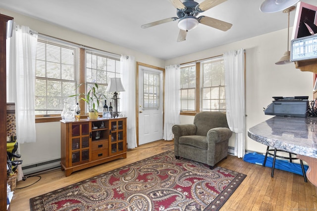 112 Vermont Ave, Stratford, CT 06615 - living area featuring hardwood / wood-style floors, healthy amount of natural light, and a ceiling fan