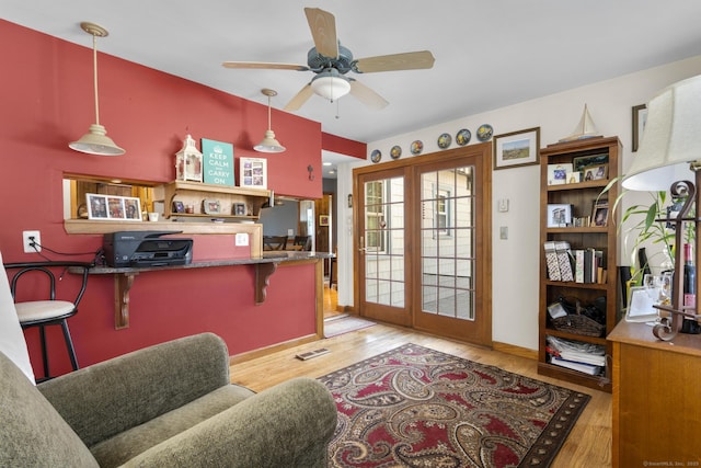 112 Vermont Ave, Stratford, CT 06615 - kitchen with wood finished floors, a ceiling fan, french doors, and decorative light fixtures