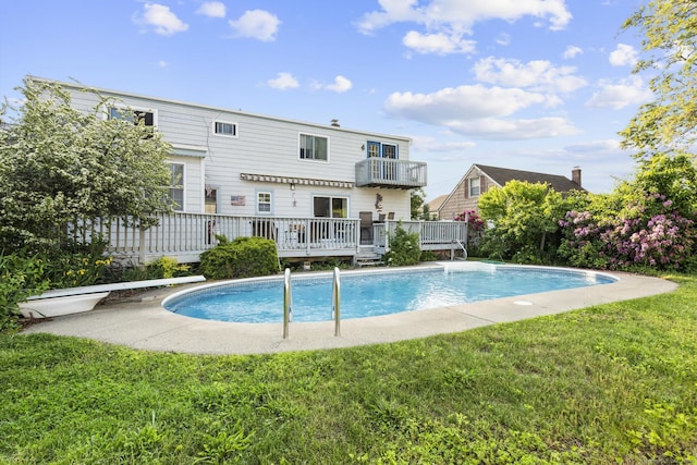 112 Vermont Ave, Stratford, CT 06615 - rear view of house with an outdoor pool, a yard, a deck, and a balcony