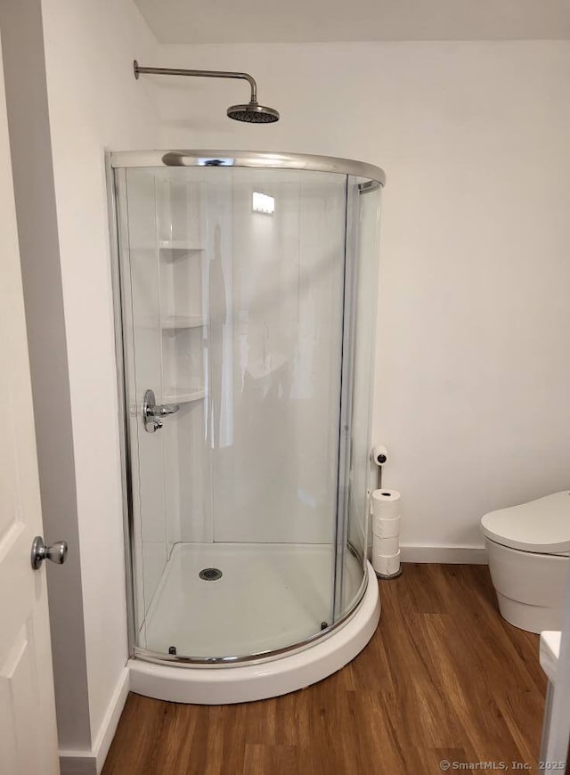 44 Tolland Ave Apt 54, Stafford, CT 06076 - bathroom with baseboards, a stall shower, and wood finished floors