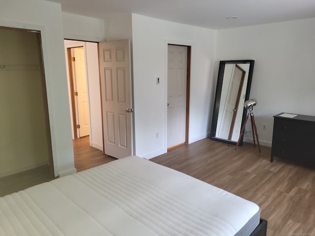 44 Tolland Ave Apt 54, Stafford, CT 06076 - bedroom with wood finished floors and baseboards