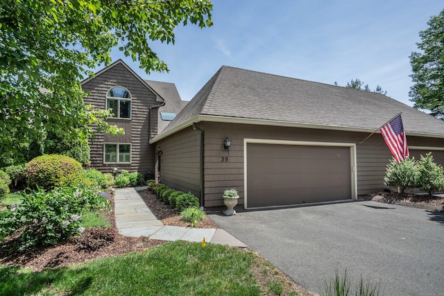 35 Saddle Rdg Unit 35, Bloomfield, CT 06002 - view of front facade with a shingled roof, driveway, and a garage