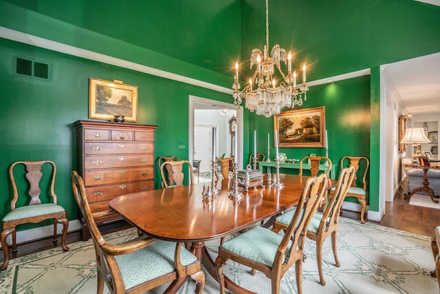 35 Saddle Rdg Unit 35, Bloomfield, CT 06002 - dining room with a chandelier, wood finished floors, baseboards, and ornamental molding
