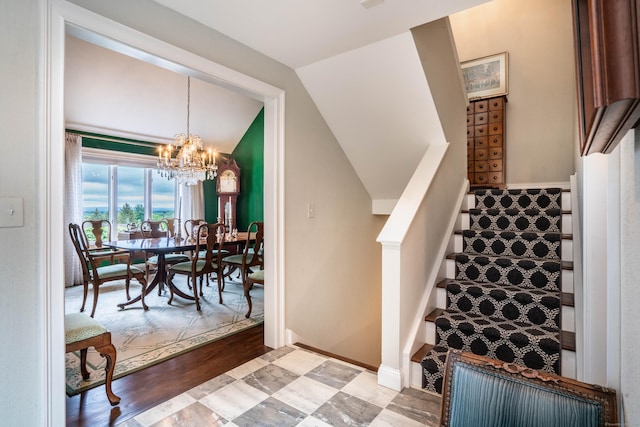 35 Saddle Rdg Unit 35, Bloomfield, CT 06002 - staircase featuring a chandelier, vaulted ceiling, and wood finished floors
