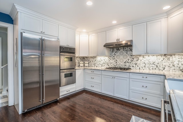 35 Saddle Rdg Unit 35, Bloomfield, CT 06002 - kitchen featuring appliances with stainless steel finishes, under cabinet range hood, light countertops, white cabinetry, and dark wood finished floors